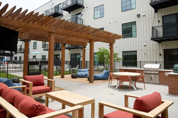 a front view of a building with sitting area