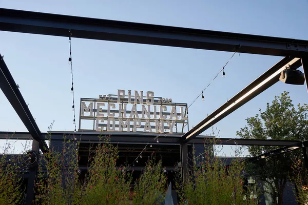 a outdoor space with patio the couches and a fireplace