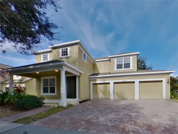 front view of a house with a yard