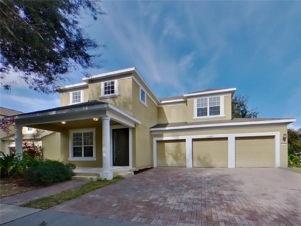 front view of a house with a yard