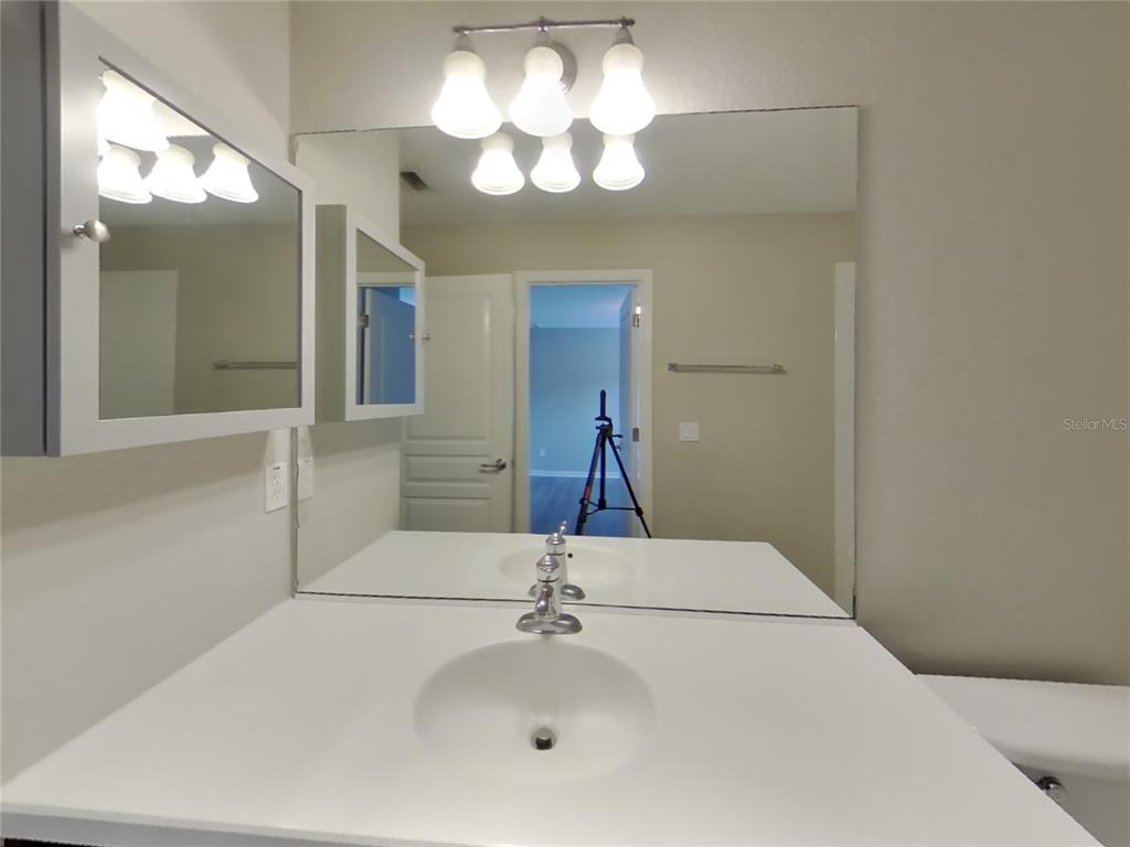 Undisclosed Address Windermere, FL 34786 - Photo 15 of 19 a bathroom with a sink and a mirror