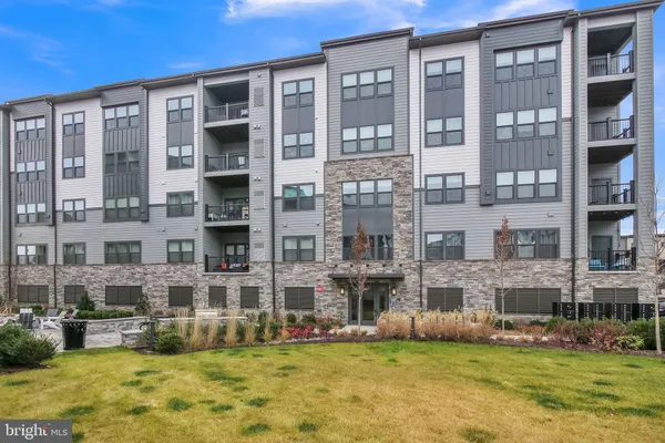 a view of a building with a yard