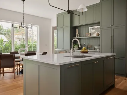 a kitchen with stainless steel appliances granite countertop a sink and a refrigerator