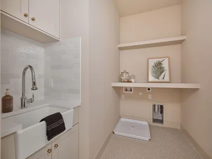 a bathroom with a sink vanity and mirror