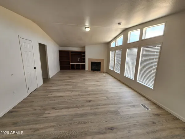 a spacious bathroom with a granite countertop sink and a mirror