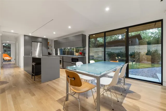 a kitchen with a table and chairs