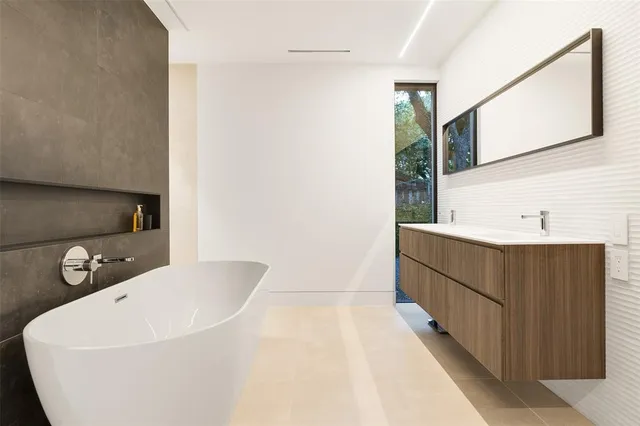 a bathroom with a bathtub and a sink