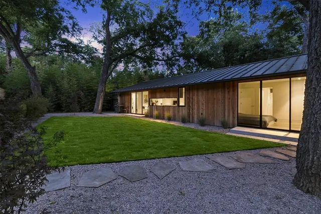 a view of a backyard with a garden and plants