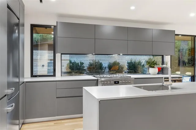 a kitchen with a sink and a window