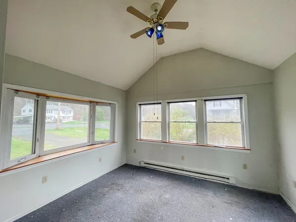 a view of an empty room with a window