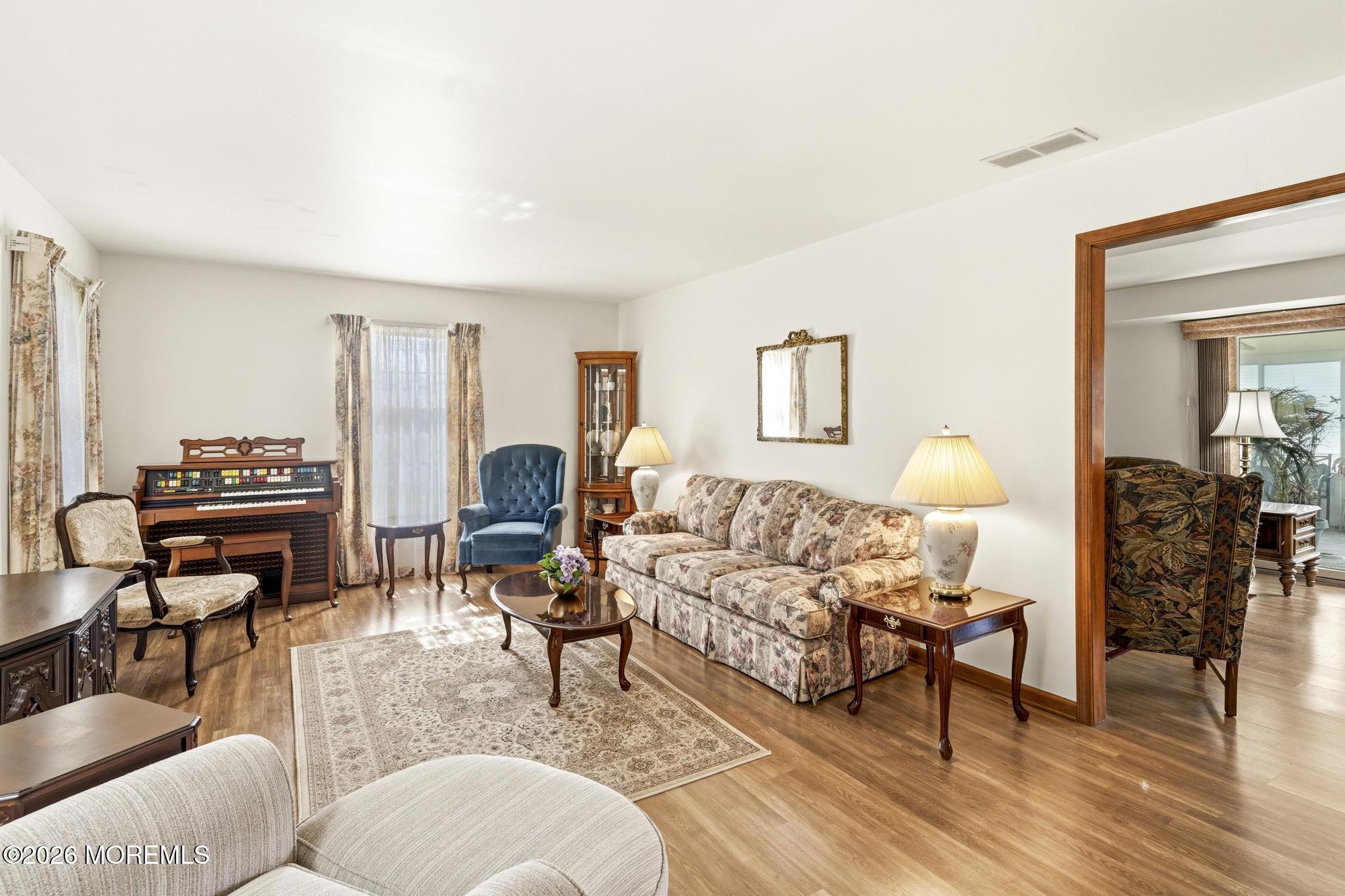 100 Sheldon Avenue Neptune Township, NJ 07753 - Photo 12 of 75 a living room with furniture and a wooden floor