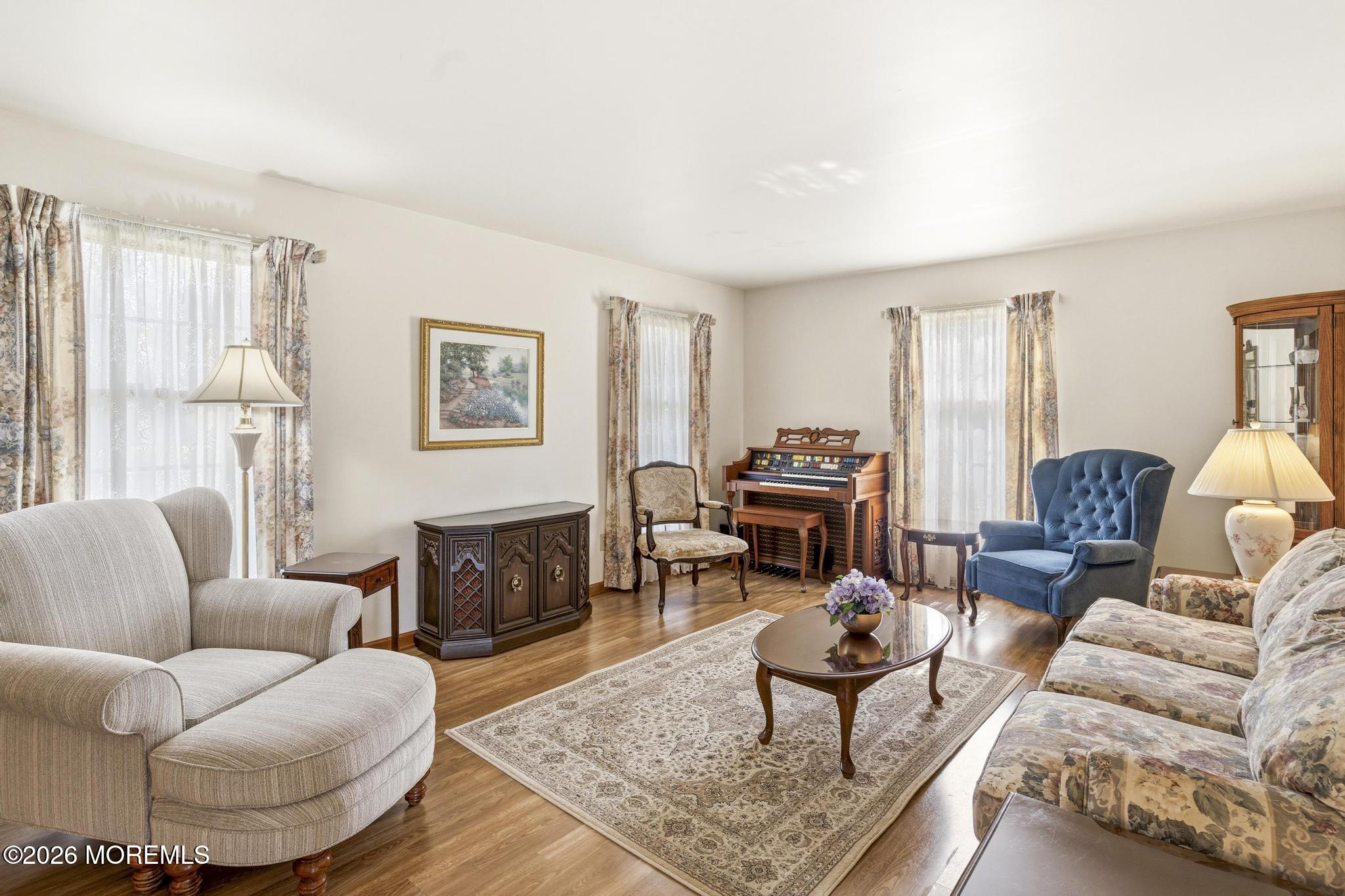 100 Sheldon Avenue Neptune Township, NJ 07753 - Photo 13 of 75 a living room with furniture a rug a lamp and a window