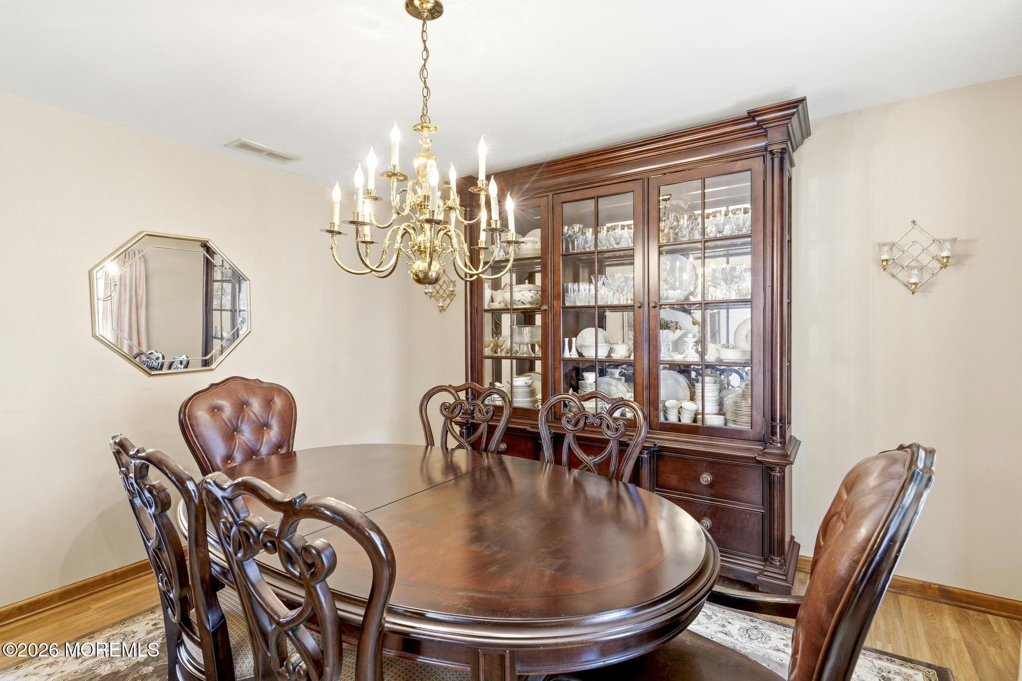 100 Sheldon Avenue Neptune Township, NJ 07753 - Photo 15 of 75 a dining room with furniture a chandelier and wooden floor