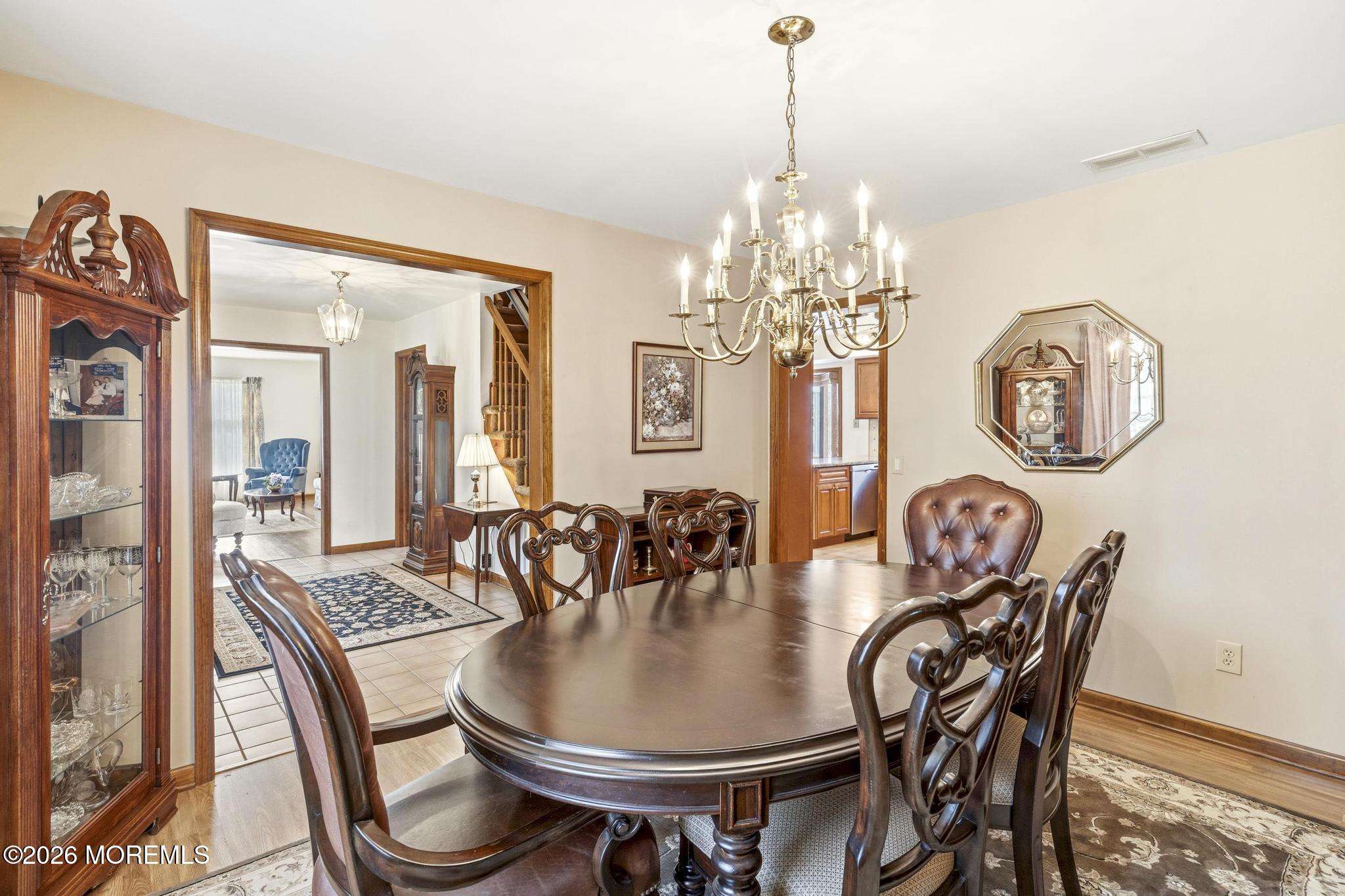100 Sheldon Avenue Neptune Township, NJ 07753 - Photo 16 of 75 a dining room with furniture a chandelier and wooden floor