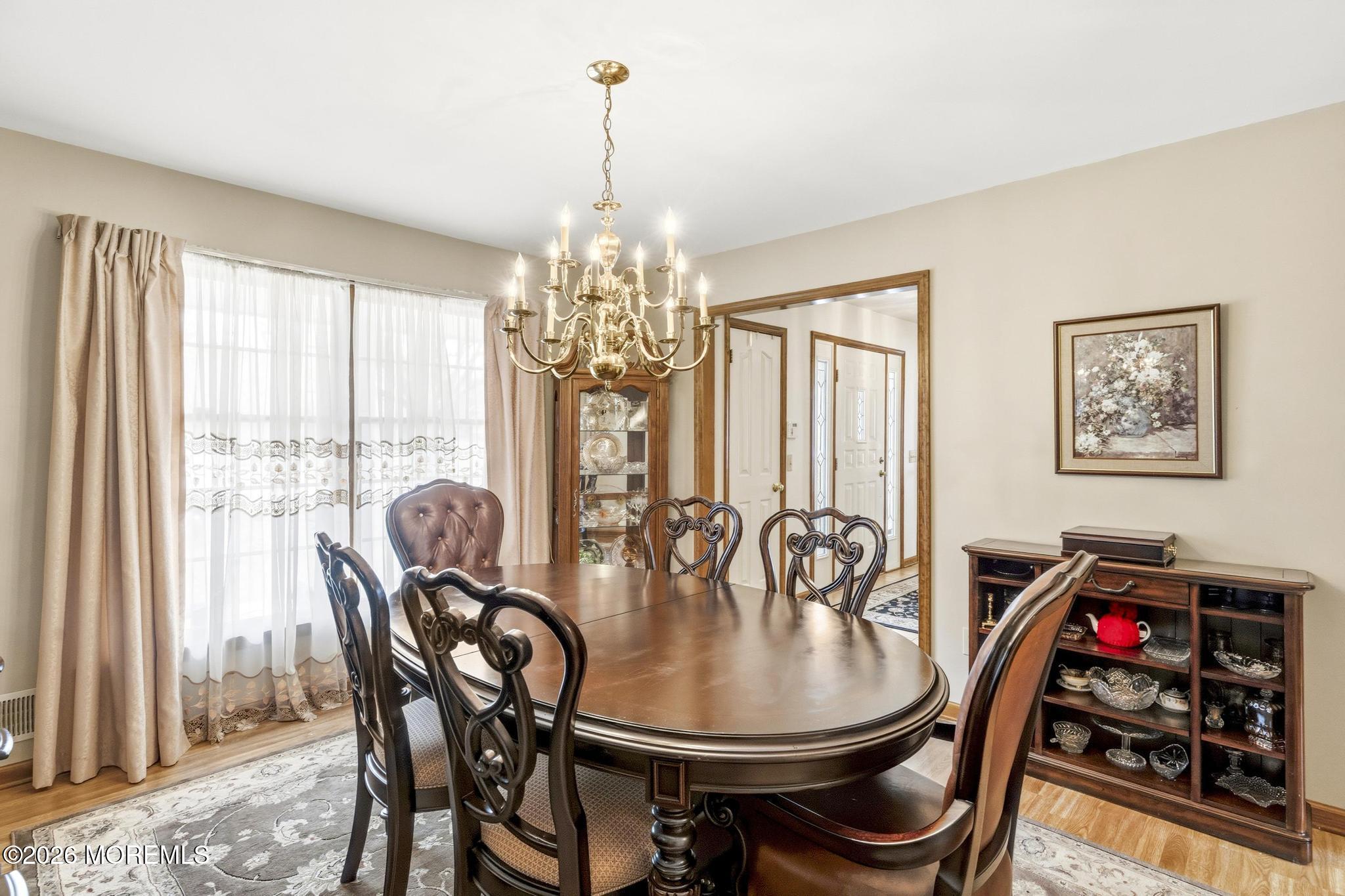 100 Sheldon Avenue Neptune Township, NJ 07753 - Photo 17 of 75 a view of a dining room with furniture wooden floor and chandelier