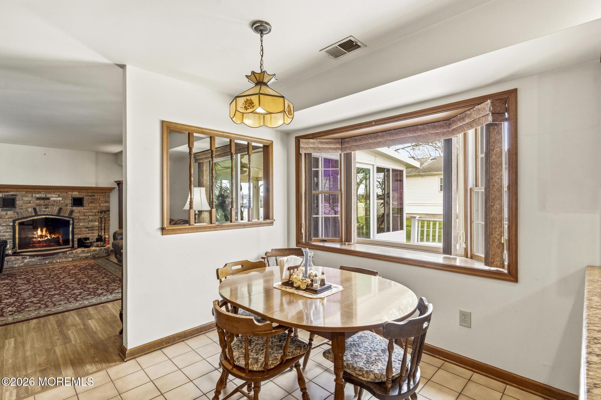 100 Sheldon Avenue Neptune Township, NJ 07753 - Photo 23 of 75 a view of a dining room with furniture wooden floor livingroom and chandelier