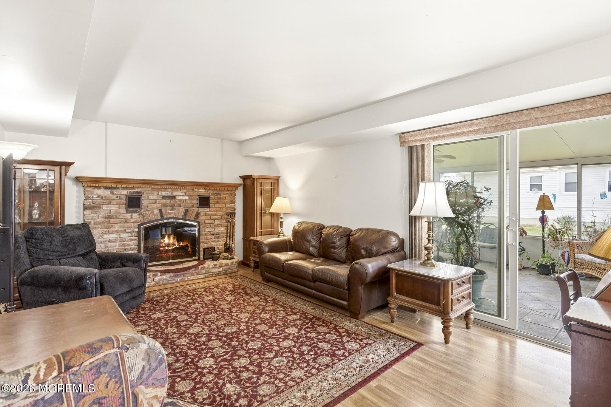 100 Sheldon Avenue Neptune Township, NJ 07753 - Photo 25 of 75 a living room with furniture and a fireplace