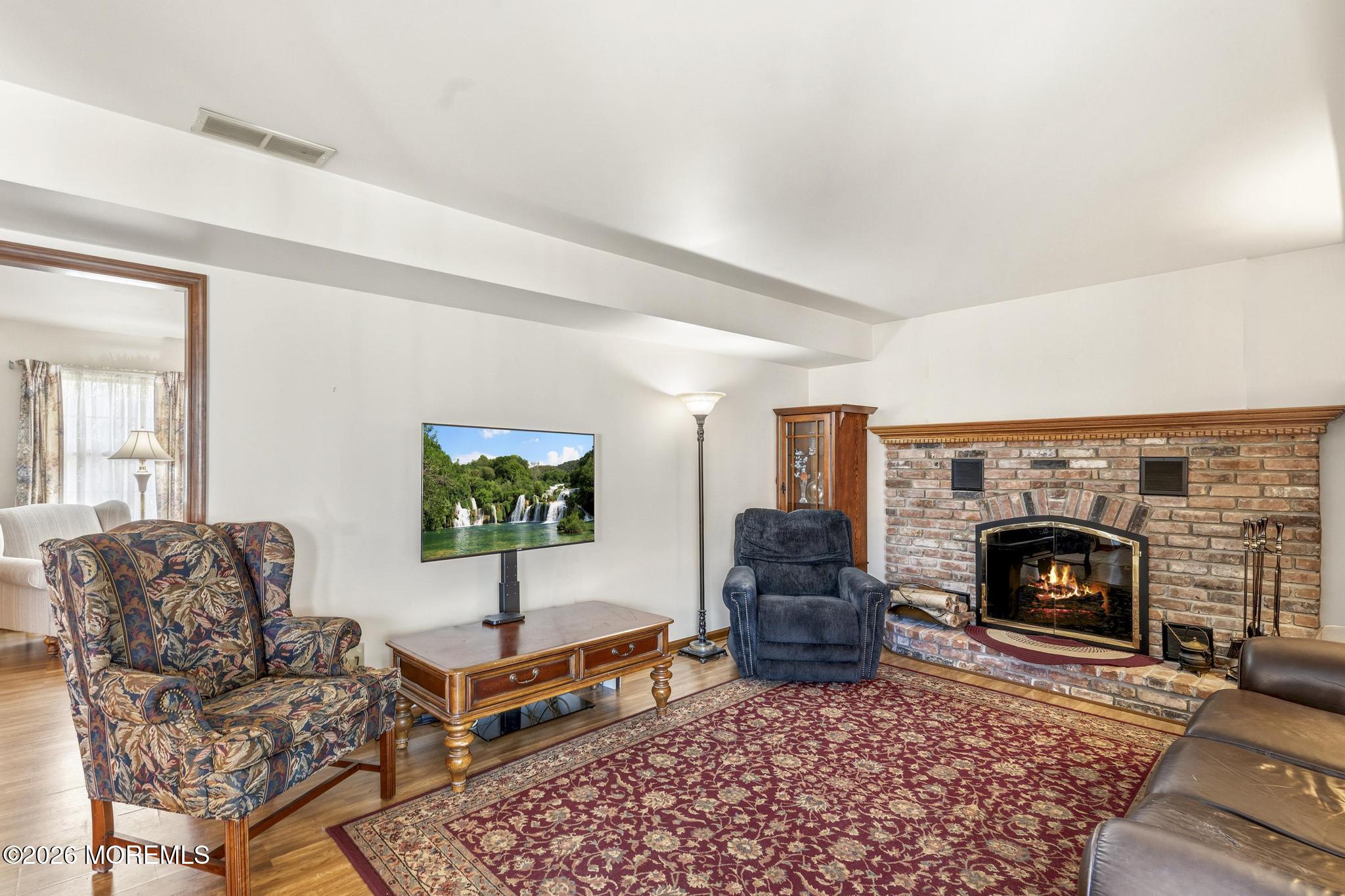 100 Sheldon Avenue Neptune Township, NJ 07753 - Photo 26 of 75 a living room with furniture a rug and a fireplace