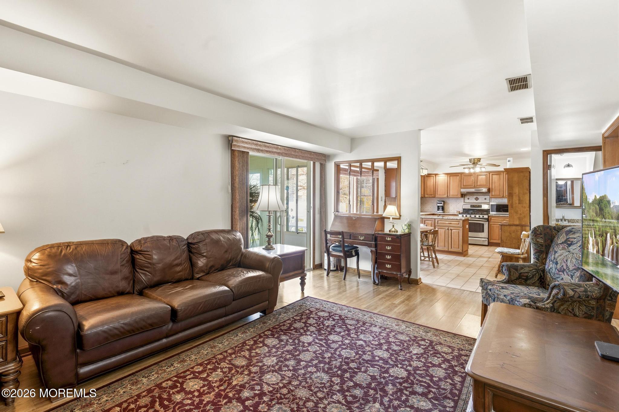 100 Sheldon Avenue Neptune Township, NJ 07753 - Photo 27 of 75 a living room with furniture ceiling fan and a rug