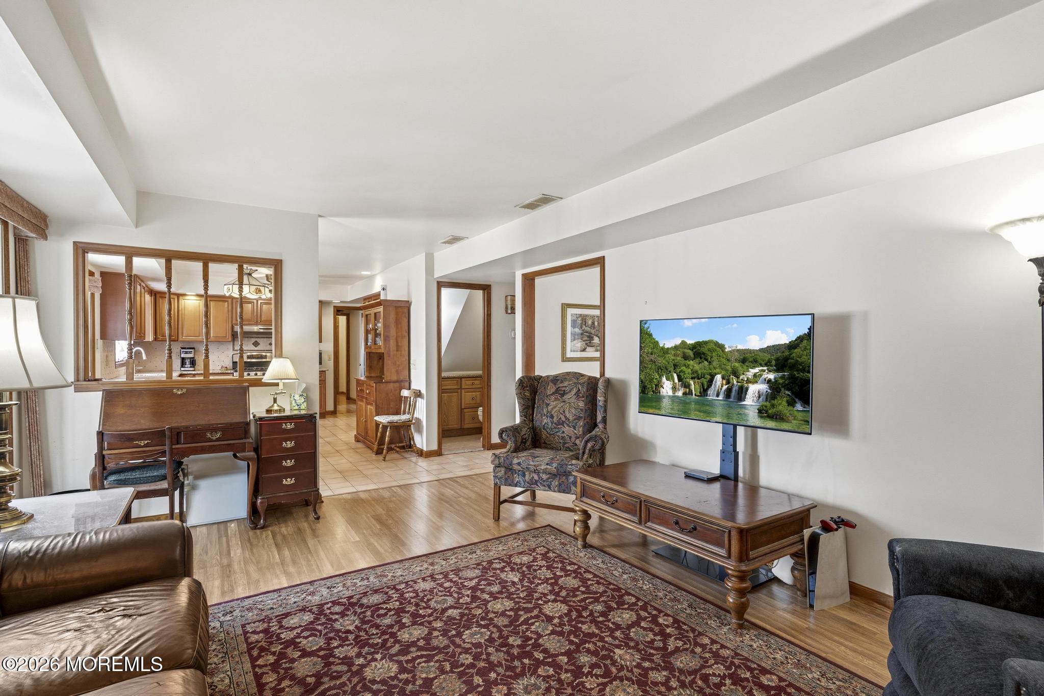 100 Sheldon Avenue Neptune Township, NJ 07753 - Photo 28 of 75 a living room with furniture and a flat screen tv