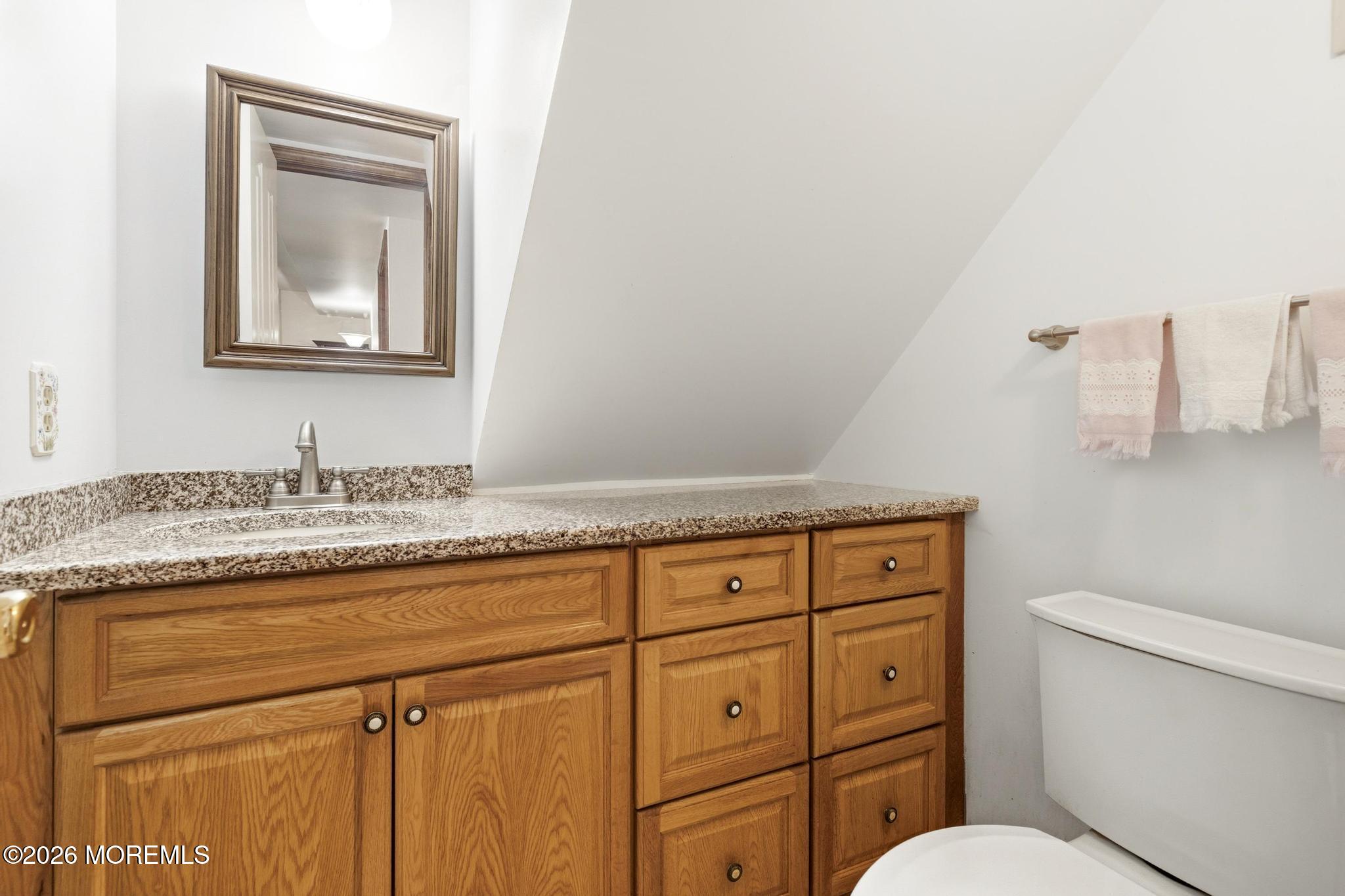 100 Sheldon Avenue Neptune Township, NJ 07753 - Photo 29 of 75 a bathroom with a granite countertop toilet sink and mirror