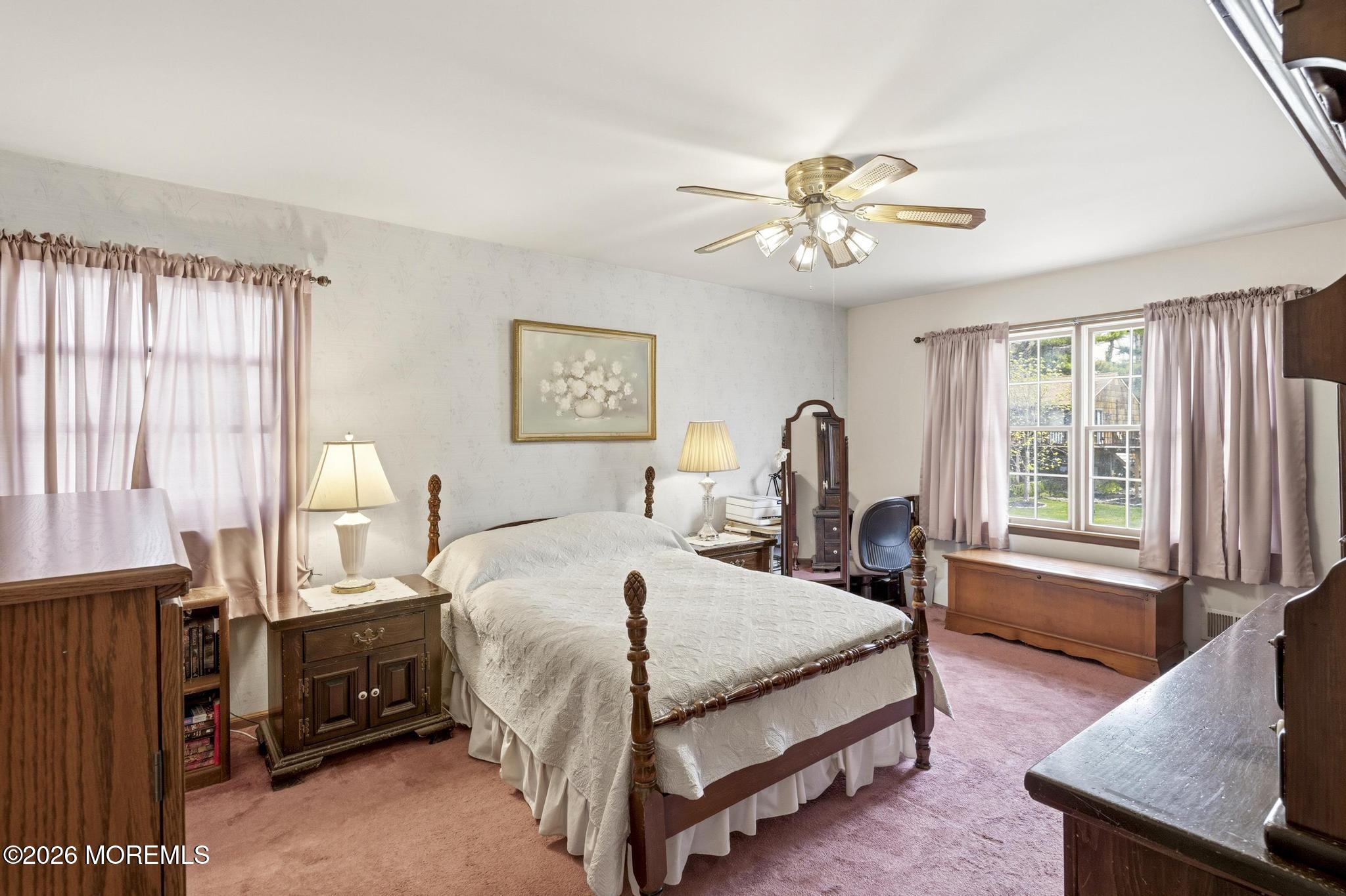 100 Sheldon Avenue Neptune Township, NJ 07753 - Photo 32 of 75 a bedroom with a bed and a chandelier