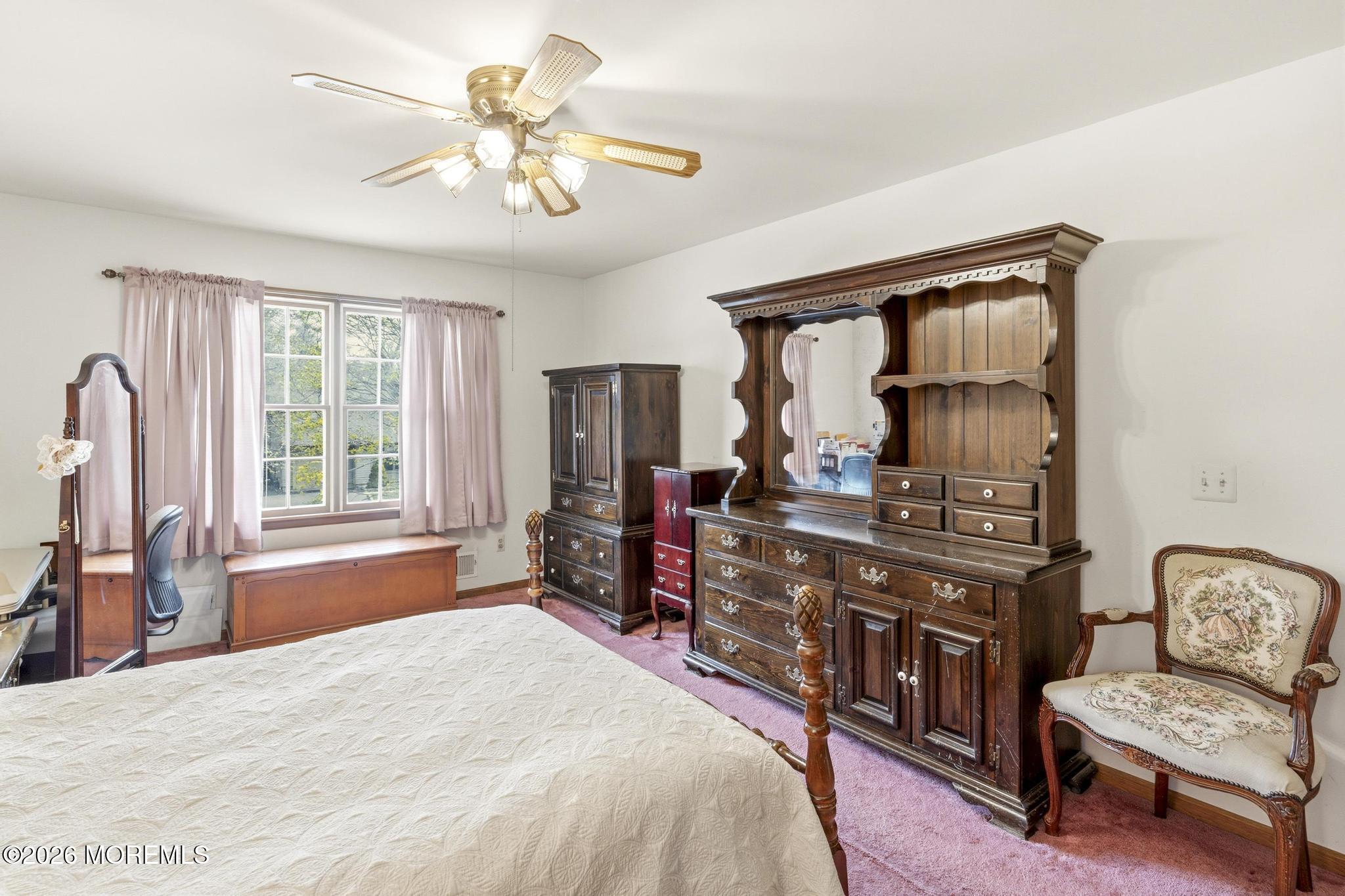 100 Sheldon Avenue Neptune Township, NJ 07753 - Photo 33 of 75 a bed room with a bed and a chair