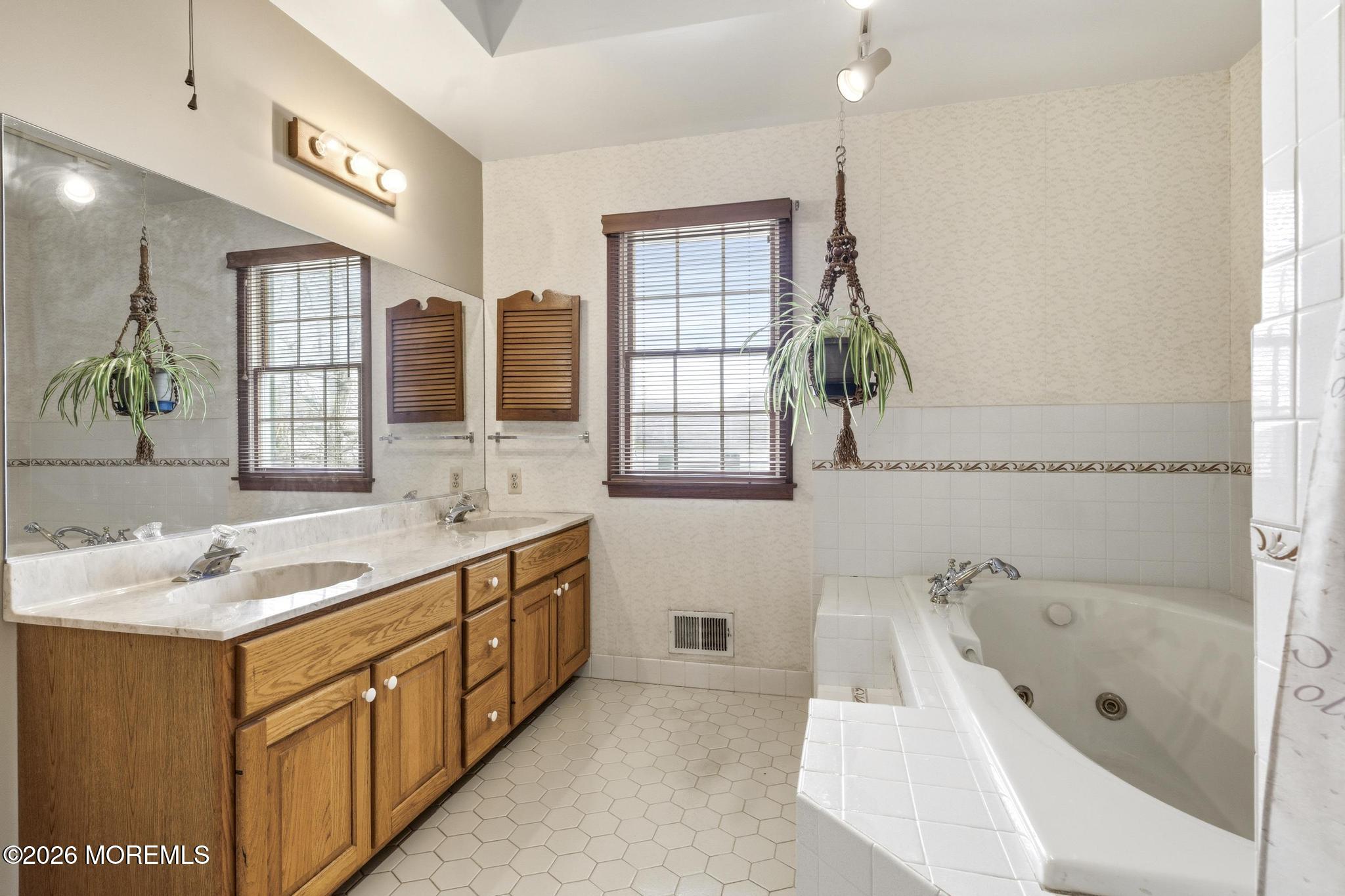 100 Sheldon Avenue Neptune Township, NJ 07753 - Photo 35 of 75 a bathroom with a tub sink and mirror