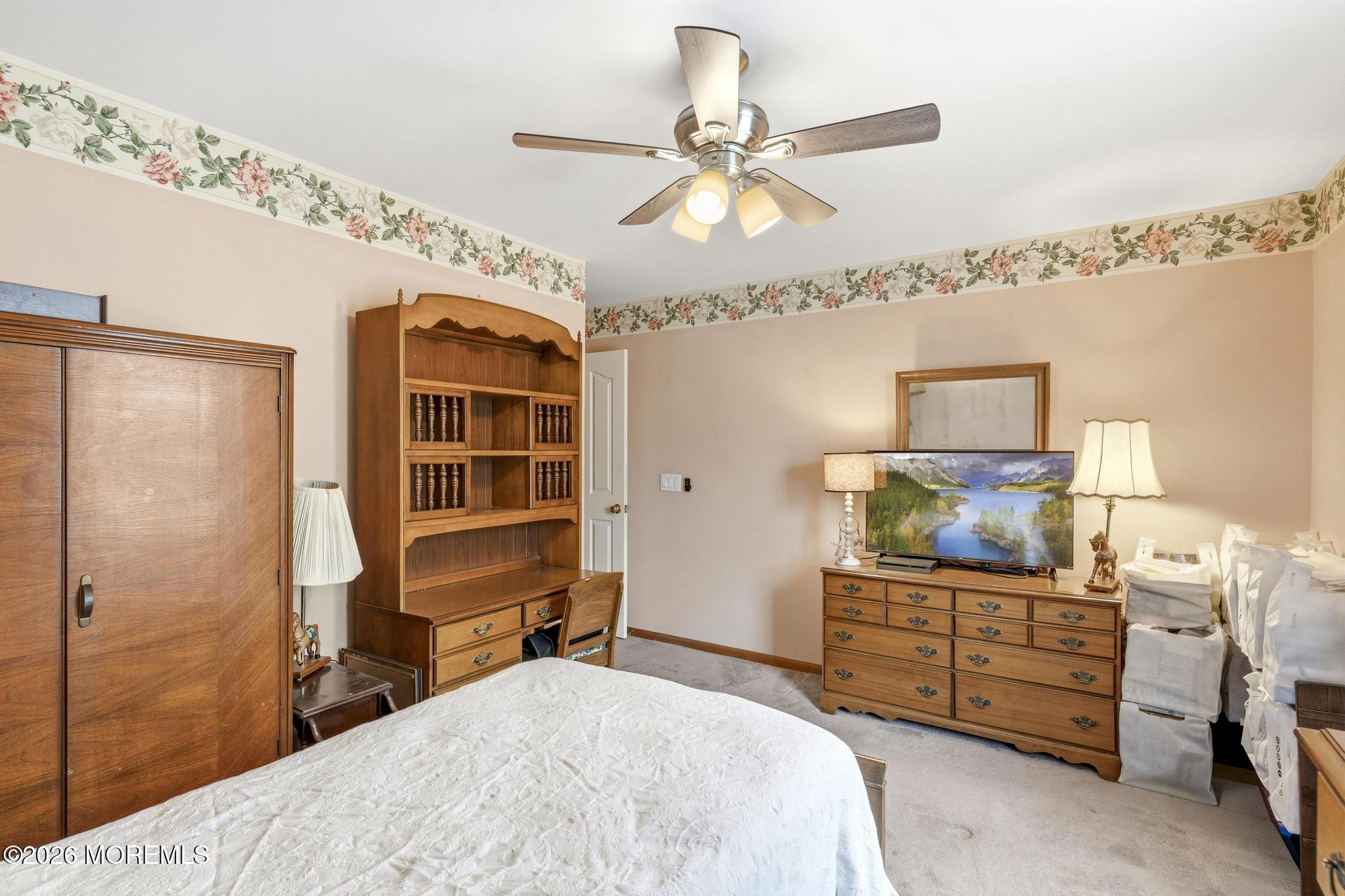 100 Sheldon Avenue Neptune Township, NJ 07753 - Photo 42 of 75 a bedroom with a bed and a chandelier