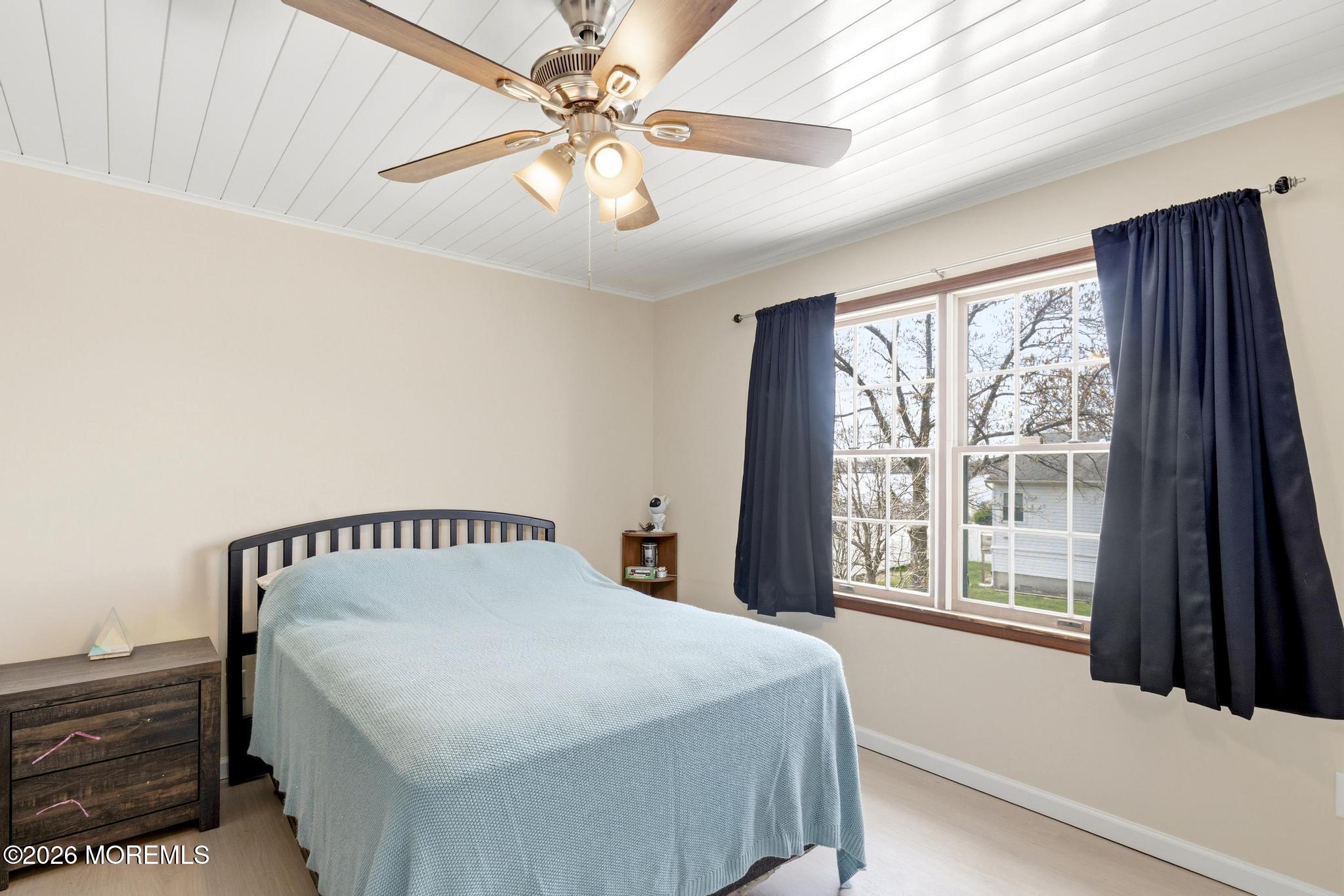 100 Sheldon Avenue Neptune Township, NJ 07753 - Photo 43 of 75 a bedroom with a bed and a large window