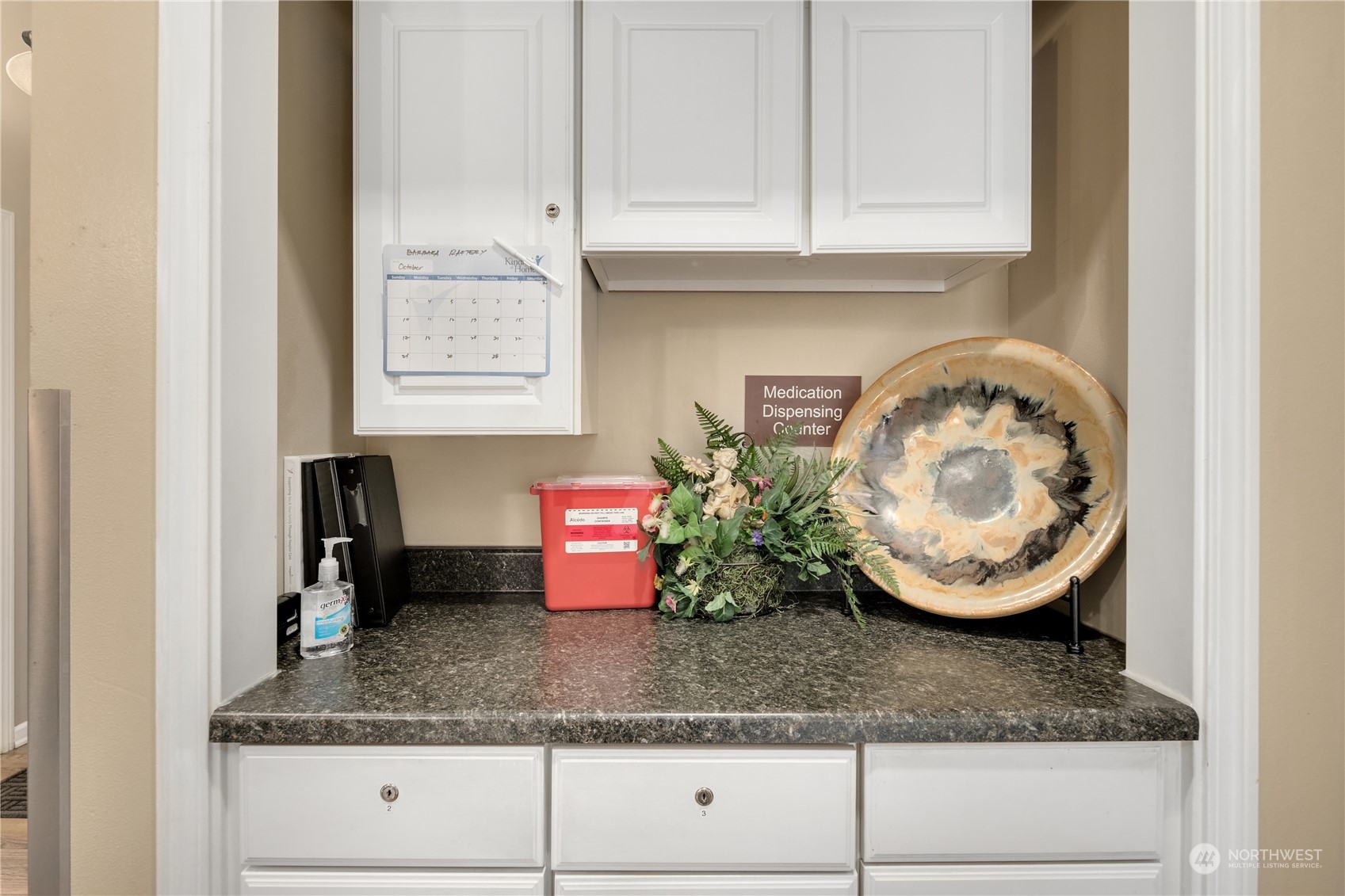 Undisclosed Address Bothell, WA 98021 - Photo 11 of 16 a bathroom with a granite countertop white cabinets and a sink