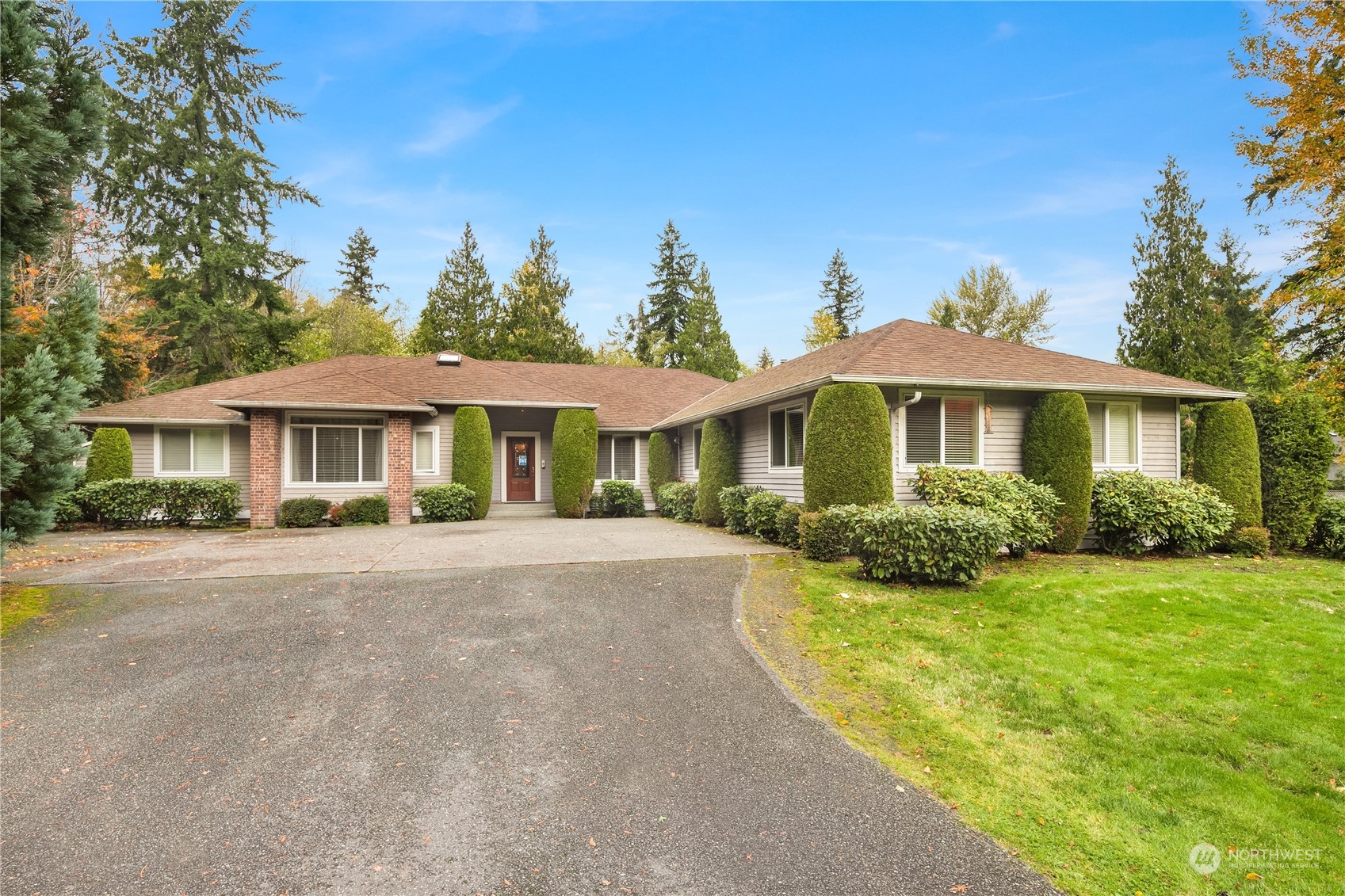 Undisclosed Address Bothell, WA 98021 - Photo 2 of 16 a front view of a house with yard patio and green space