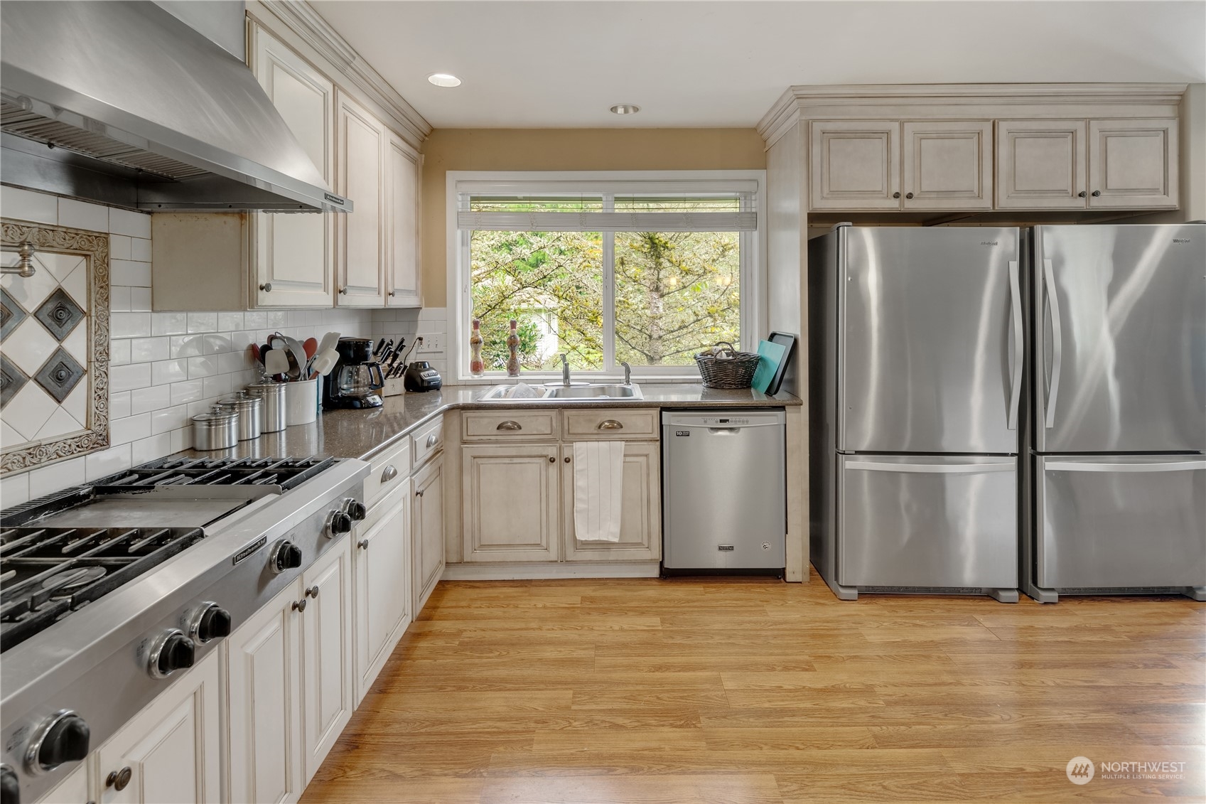 Undisclosed Address Bothell, WA 98021 - Photo 5 of 16 a kitchen with stainless steel appliances a refrigerator sink and cabinets