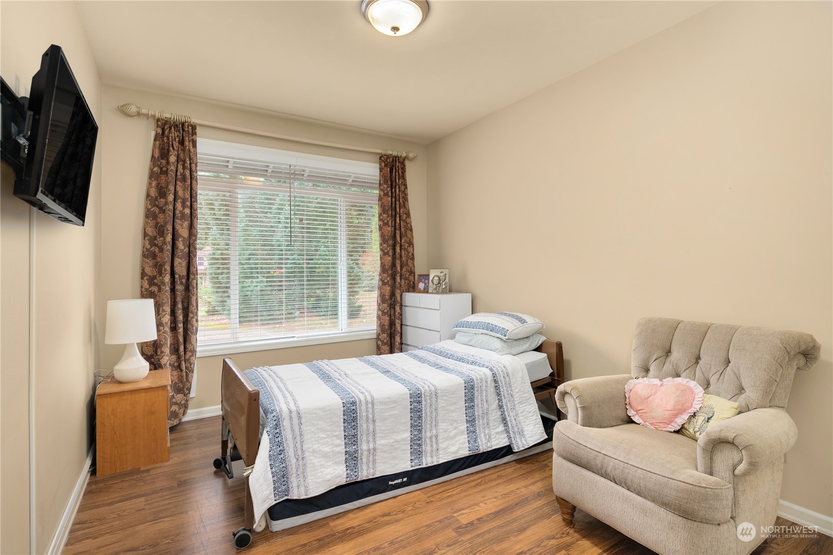 Undisclosed Address Bothell, WA 98021 - Photo 9 of 16 a bedroom with a bed and flat screen tv