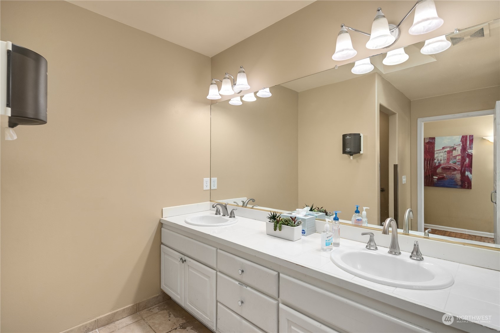 Undisclosed Address Bothell, WA 98021 - Photo 10 of 16 a bathroom with a double vanity sink and a mirror