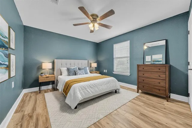 a bedroom with a bed and dresser