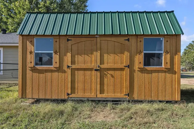 a view of building with yard and staircase