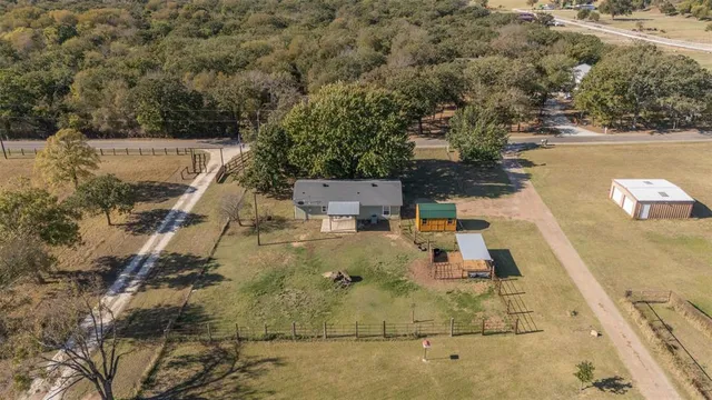 a view of a swimming pool with a yard