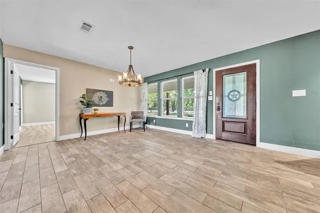 a view of an empty room with glass door