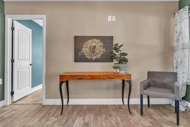 a view of a livingroom with furniture and wooden floor