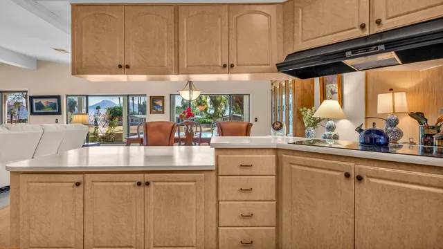 a kitchen with cabinets appliances and a counter top