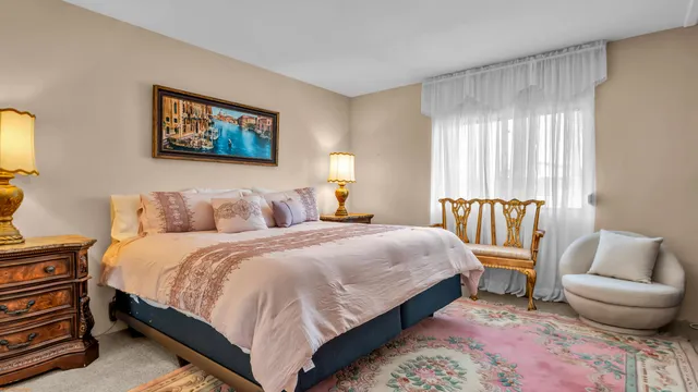 a bedroom with bed and a window