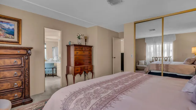 a bedroom with a bed and a view of bedroom