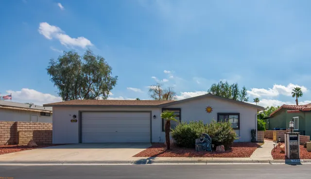 a house view with a garden space