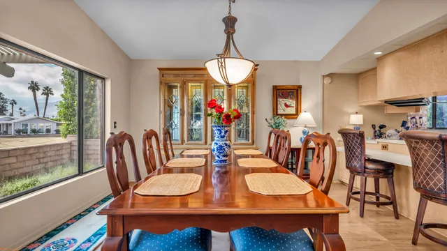 a view of a dining room with furniture window and outside view
