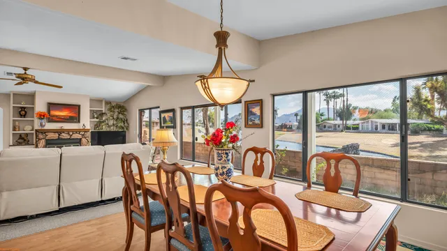 a view of a dining room with furniture window and wooden floor