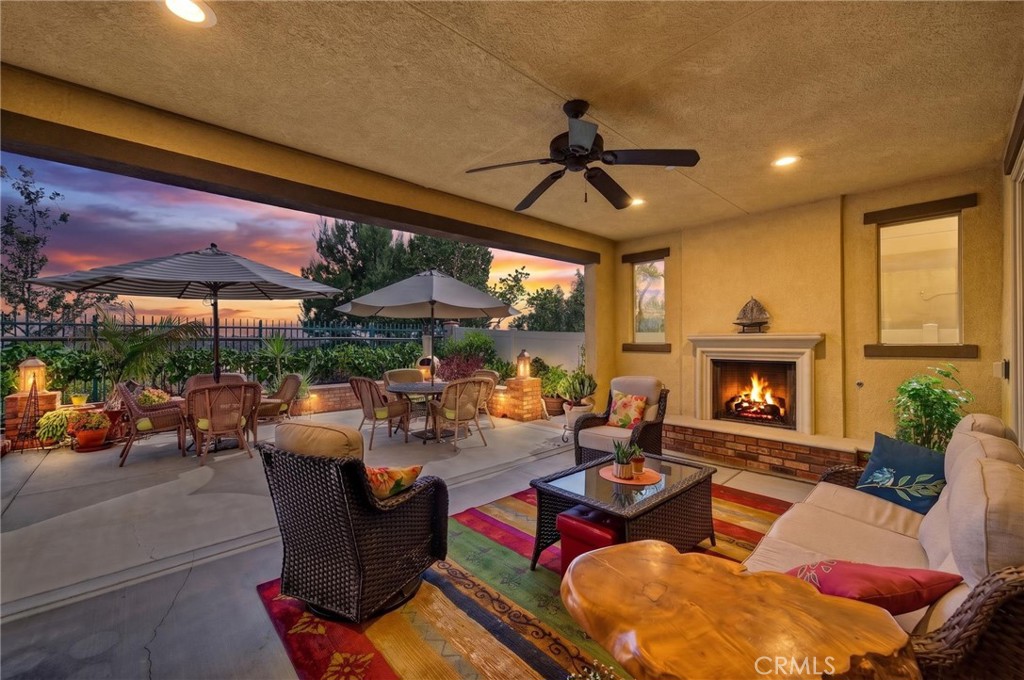 31749 Country View Road Temecula, CA 92591 - Photo 2 of 68 a living room with patio furniture and a fireplace