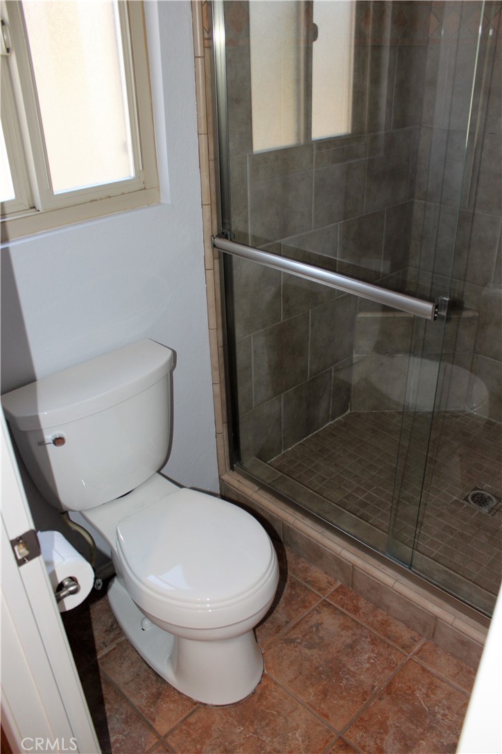 132 Oak Forest Circle Glendora, CA 91741 - Photo 39 of 44 a white toilet sitting next to a bath tub and shower