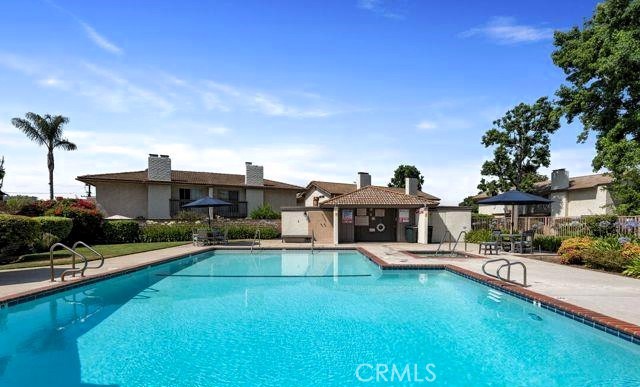 132 Oak Forest Circle Glendora, CA 91741 - Photo 43 of 44 a front view of a house with a yard table and chairs