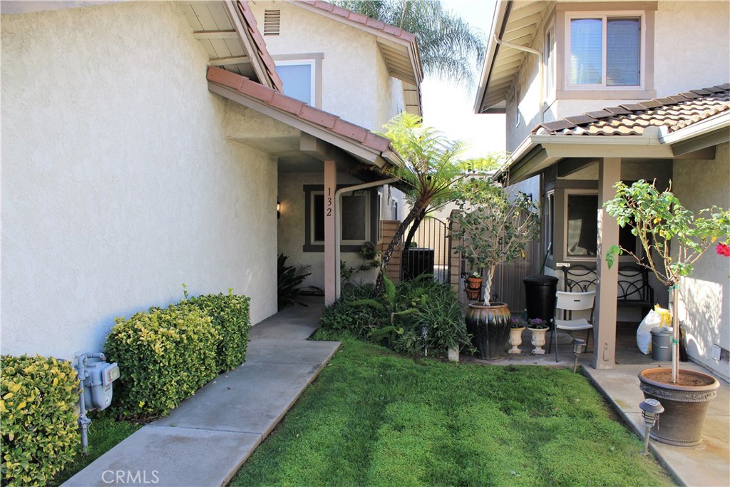 132 Oak Forest Circle Glendora, CA 91741 - Photo 9 of 44 a view of a house with potted plants and a table and chairs